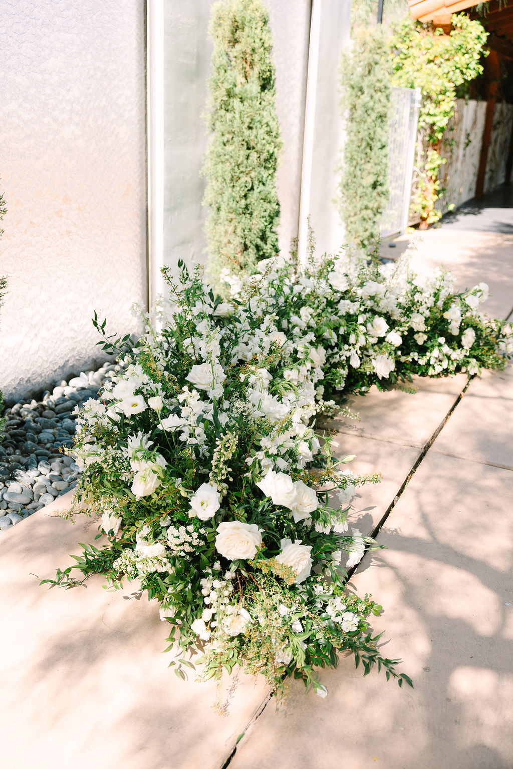 Details of a large floral piece with white roses