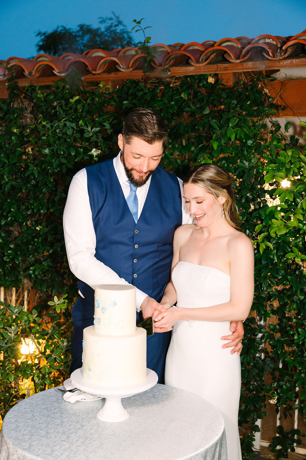 Newlyweds cut their two tier cake