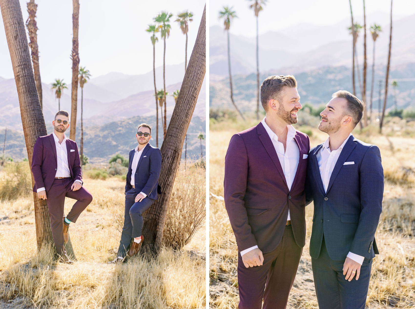Two engaged men lean on palm trees in blue and purple suits next to them with arms around each other and laughing