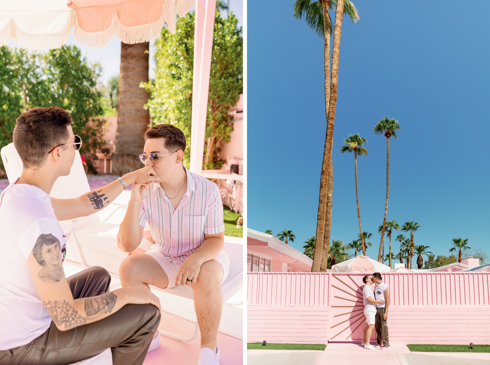A man kisses his fiancee's hand while sitting on patio beds under an umbrella in pink shirts next to them kissing against a pink wall