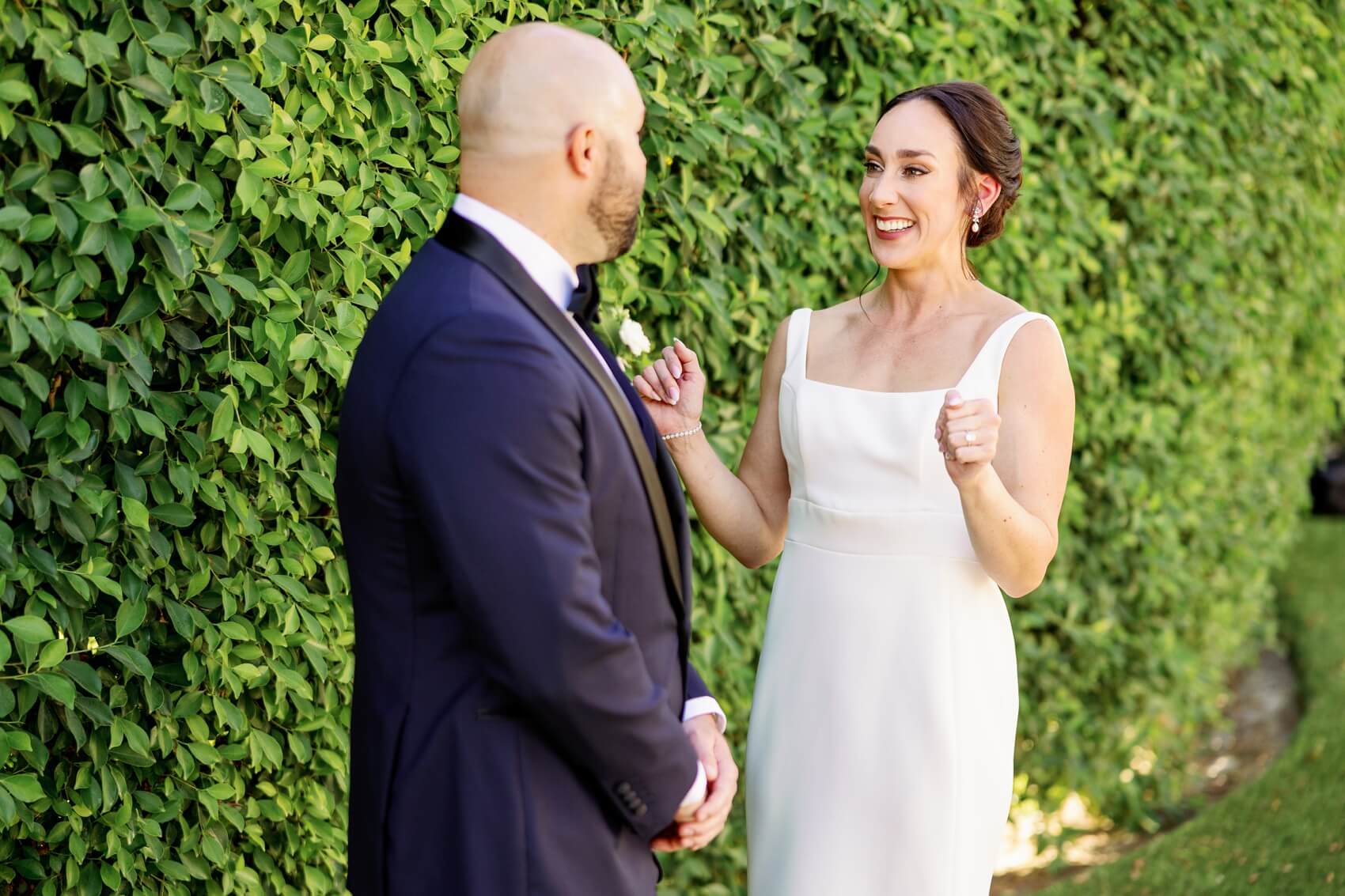 A happy bride sees her groom during their rancho las palmas wedding first look