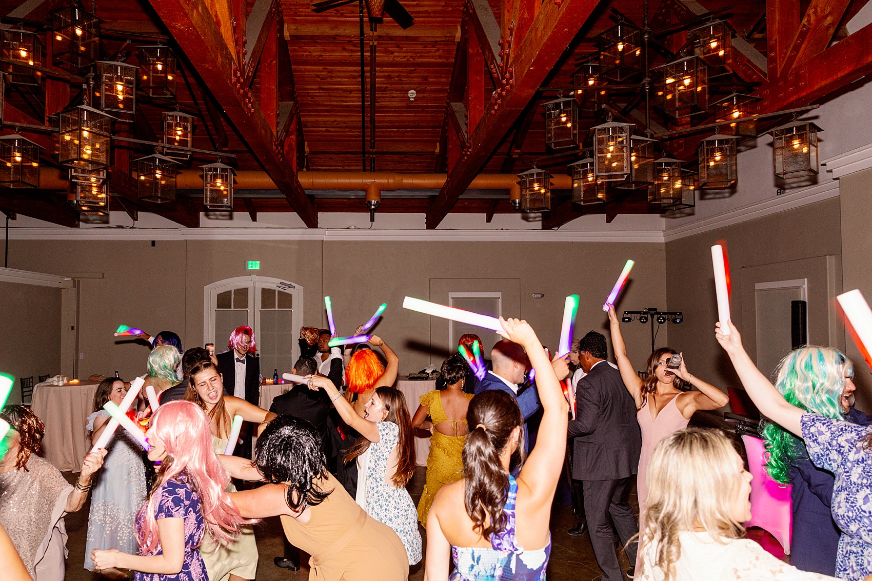 Wedding guests dance with light sticks on the dance floor at the lodge at sonoma wedding venue