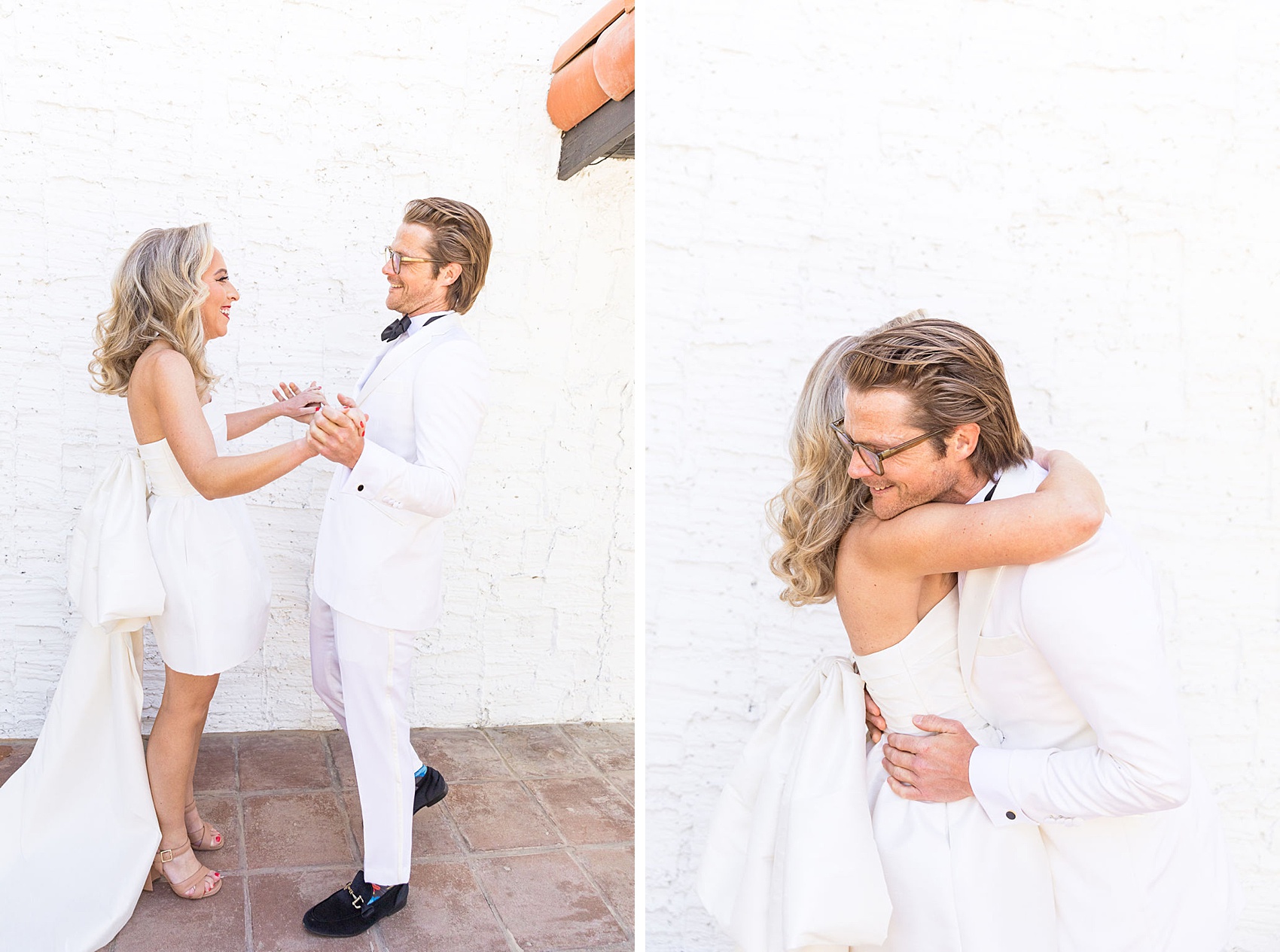 A bride and groom laugh while holding hands during their first look