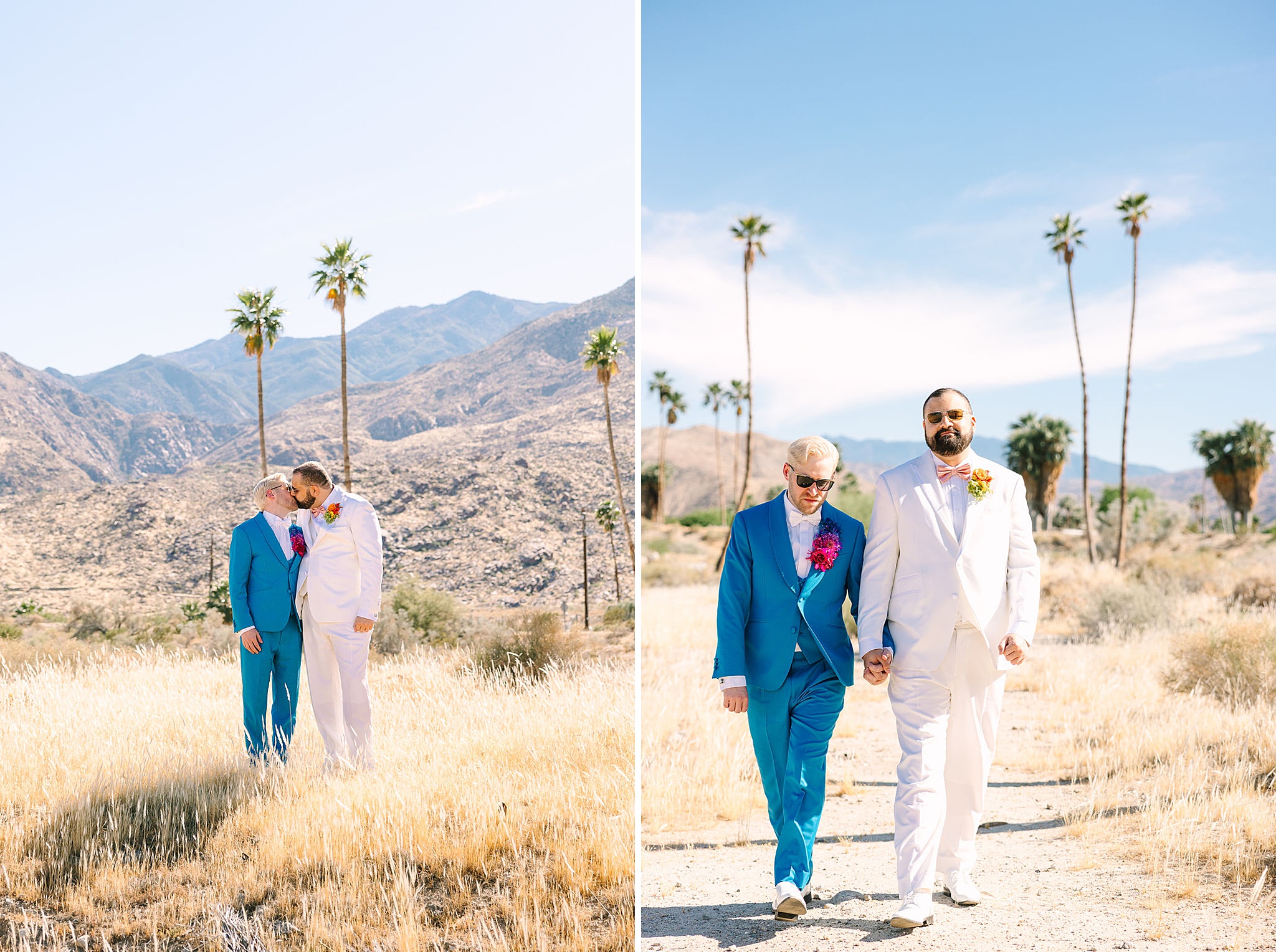 Grooms in blue and white suits walk holding hands and kissing in the desert near the mountains in palm springs